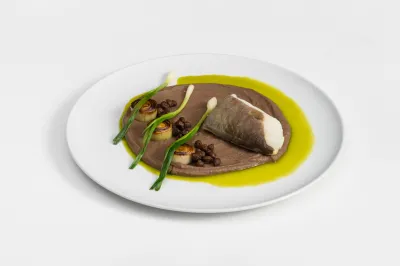 Bacalhau meia cura, grão de bico negro, cebolinha nova e alho francês